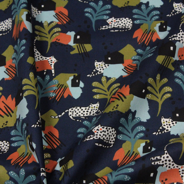 Tissu de coton JUNGLE STORY motif tropical & léopard blanc, fond bleu marine - Oeko-Tex