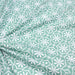 Tissu de coton AZULEJOS au motif géométrique blanc, fond vert menthe - OEKO-TEX®