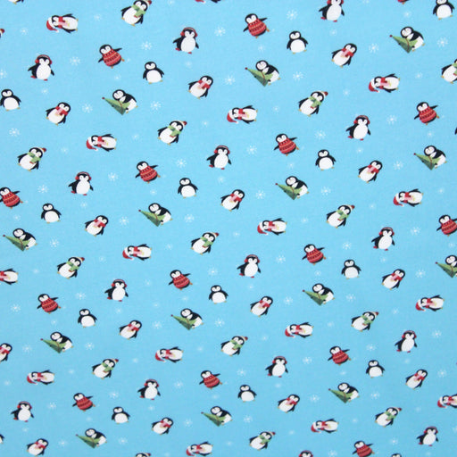 Tissu popeline de coton de Noël aux pingouins de Noël, fond bleu ciel - tissuspapi
