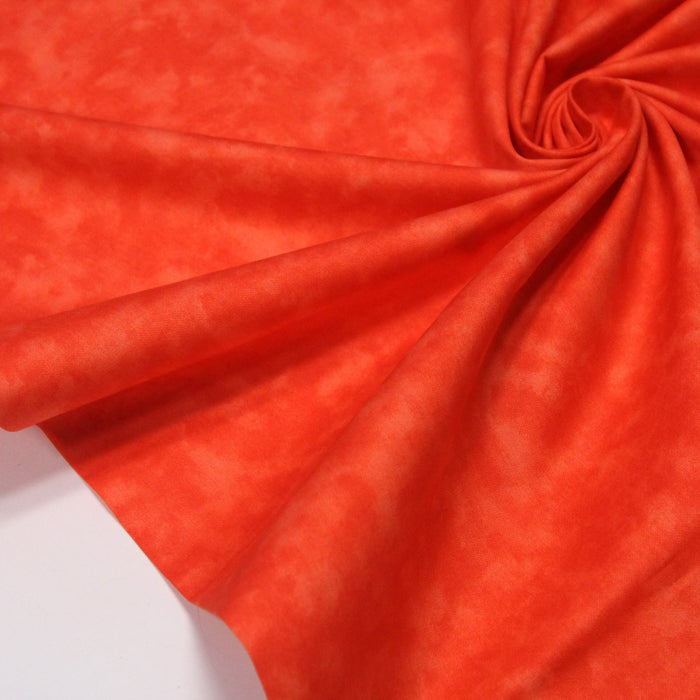 Tissu de coton Batik faux-uni marbré orange
