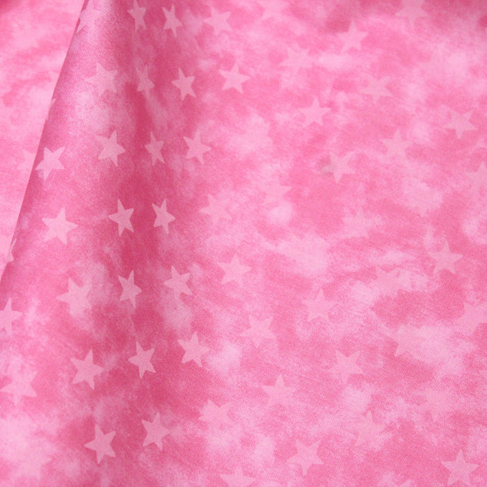 Tissu de coton marbré rose à étoiles