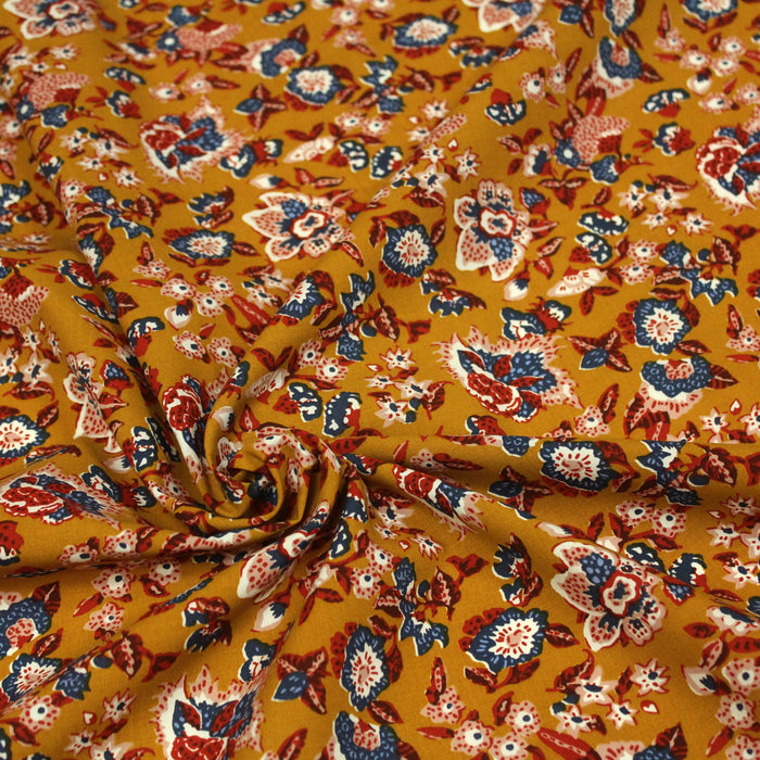 Tissu popeline de viscose ocre aux fleurs bleues et rouges - Fabrication française - Oeko-Tex