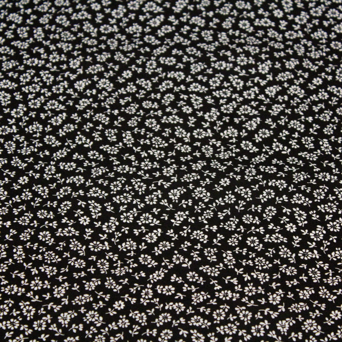 Tissu popeline de viscose noire aux fines fleurs blanches - Fabrication française - Oeko-Tex