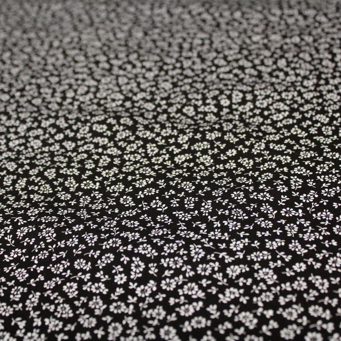 Tissu popeline de viscose noire aux fines fleurs blanches - Fabrication française - Oeko-Tex