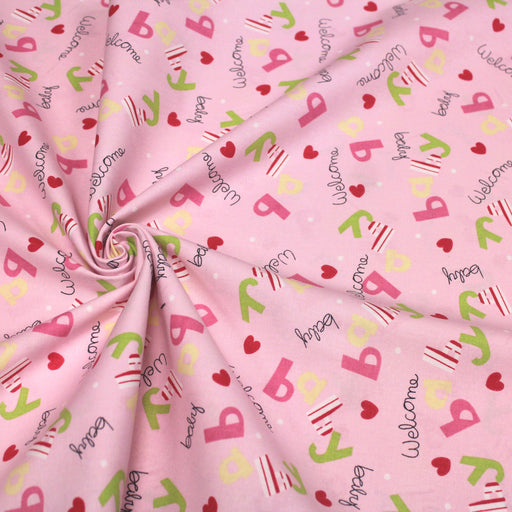 Tissu de coton bébé "Baby welcome" aux coeurs et lettres, fond rose