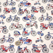 Tissu de coton aux petits vélos tricolores bleus blancs rouges, fond écru - Oeko - Tex - TissusPapi.com