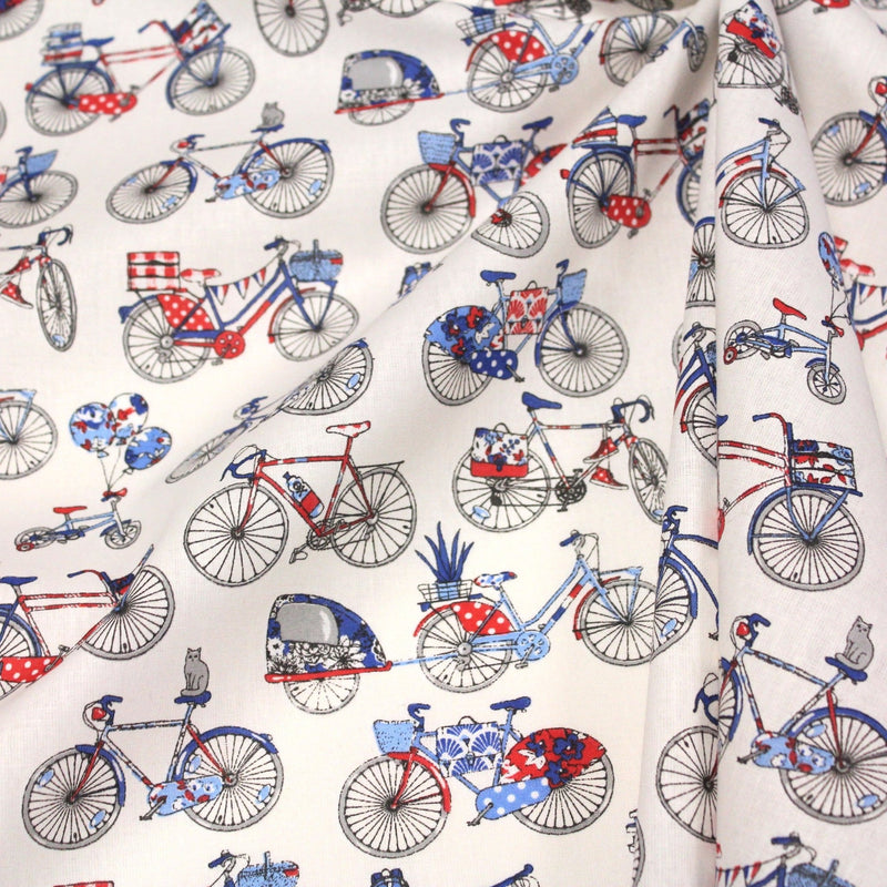 Tissu de coton aux petits vélos tricolores bleus blancs rouges, fond écru - Oeko - Tex - TissusPapi.com
