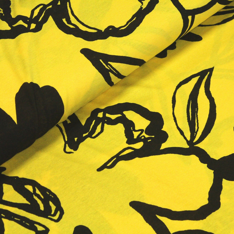 Tissu jersey de viscose jaune aux grandes fleurs noires - COLLECTION ETHNIQUE - TissusPapi.com