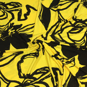 Tissu jersey de viscose jaune aux grandes fleurs noires - COLLECTION ETHNIQUE - TissusPapi.com