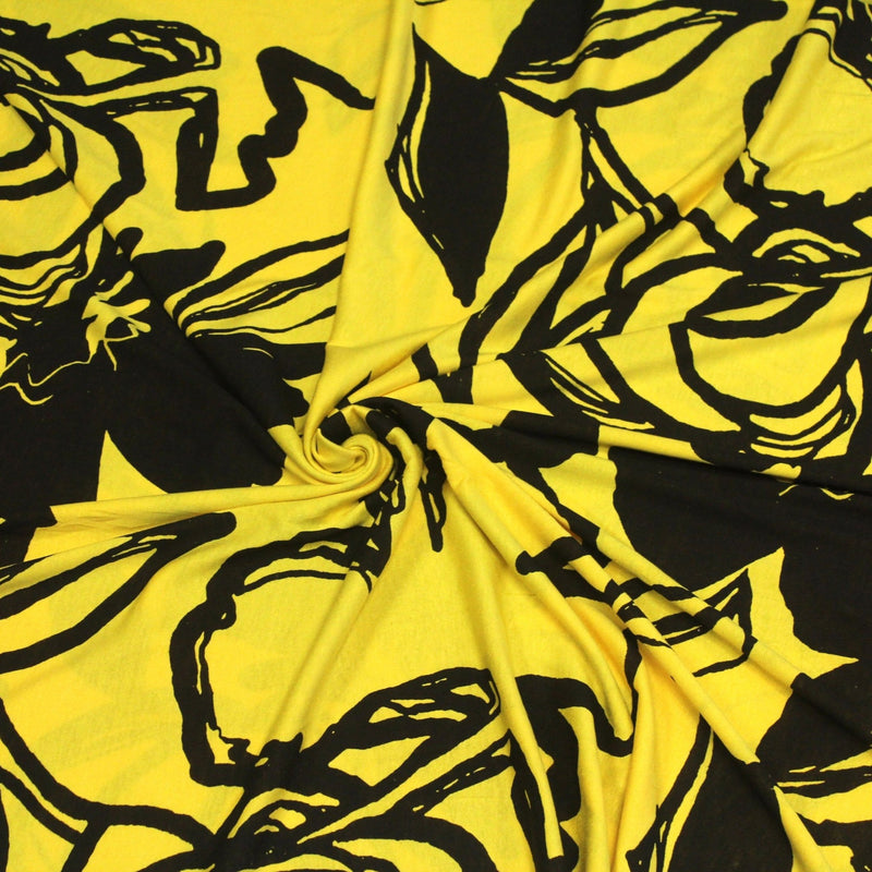Tissu jersey de viscose jaune aux grandes fleurs noires - COLLECTION ETHNIQUE - TissusPapi.com