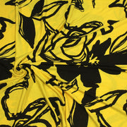 Tissu jersey de viscose jaune aux grandes fleurs noires - COLLECTION ETHNIQUE - TissusPapi.com