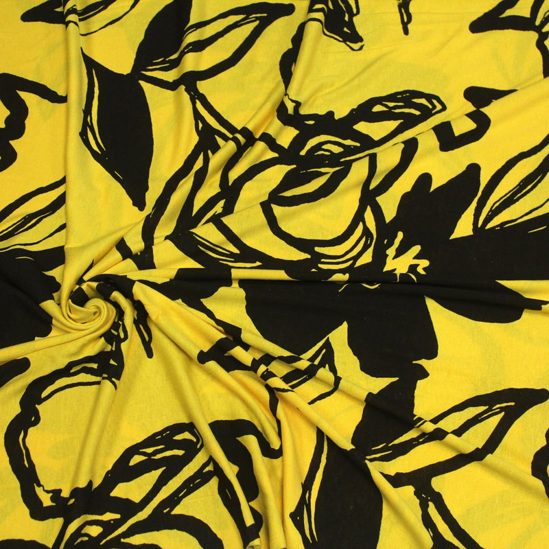Tissu jersey de viscose jaune aux grandes fleurs noires - COLLECTION ETHNIQUE - TissusPapi.com