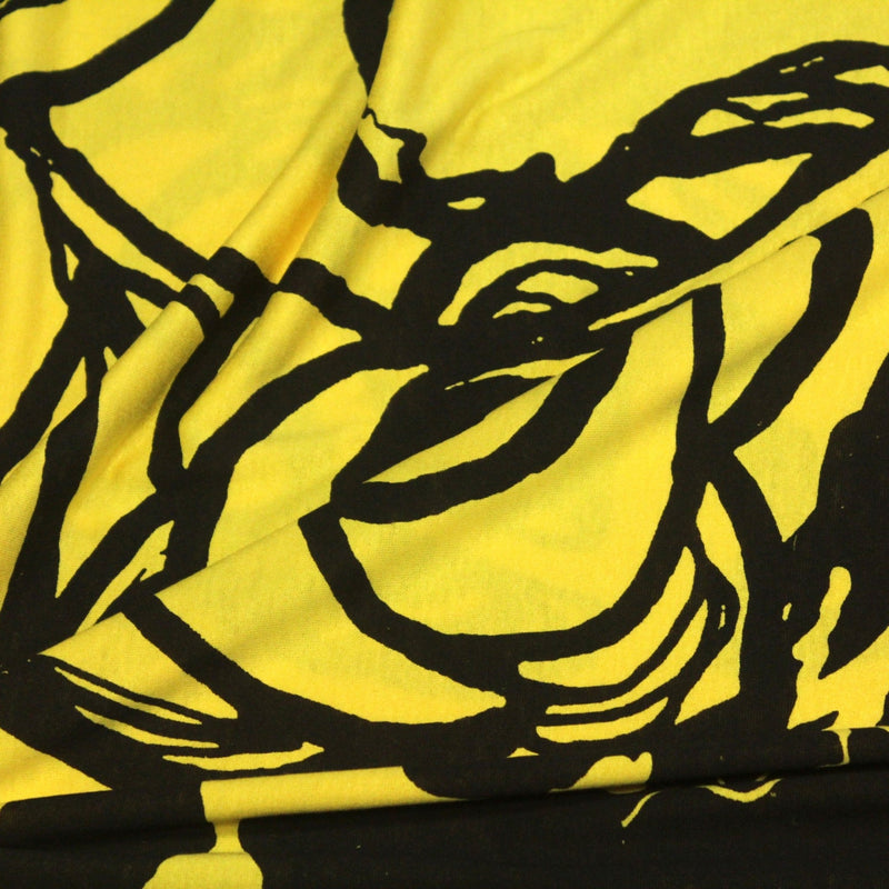 Tissu jersey de viscose jaune aux grandes fleurs noires - COLLECTION ETHNIQUE - TissusPapi.com