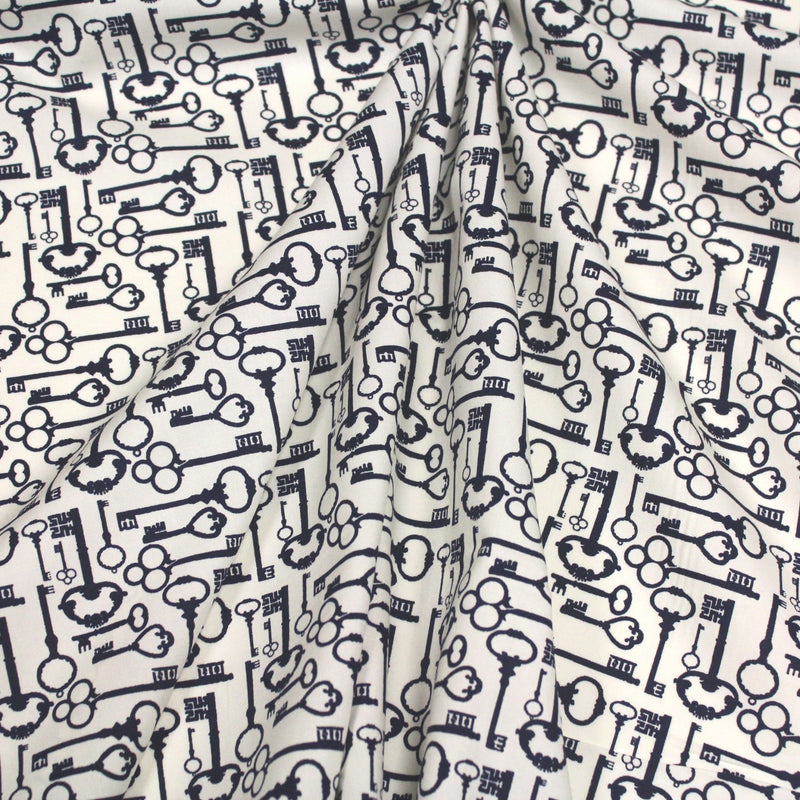 Tissu popeline de coton aux clefs vintage bleu marine, fond écru - TissusPapi.com