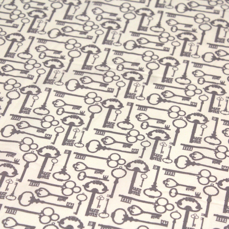 Tissu popeline de coton aux clefs vintage taupe, fond écru - TissusPapi.com