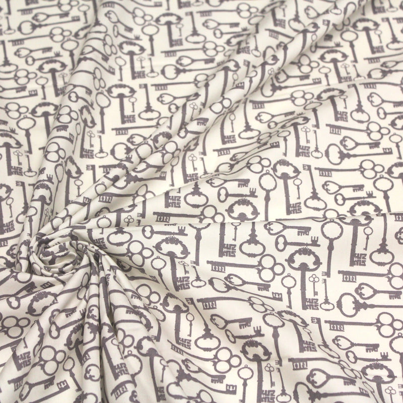 Tissu popeline de coton aux clefs vintage taupe, fond écru - TissusPapi.com