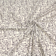 Tissu popeline de coton aux clefs vintage taupe, fond écru - TissusPapi.com