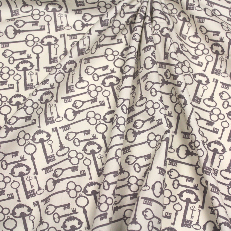 Tissu popeline de coton aux clefs vintage taupe, fond écru - TissusPapi.com