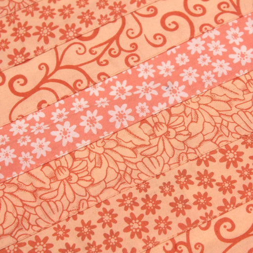 Tissu de coton batik patchwork aux fleurs variées, tons orange et pêche - tissuspapi