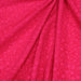 Tissu de coton batik gaufré OCÉANIE aux fleurs et taches roses, fond rose framboise