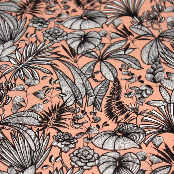 Tissu de coton JAVA aux fleurs & feuilles noires et blanches, fond corail - Oeko-Tex