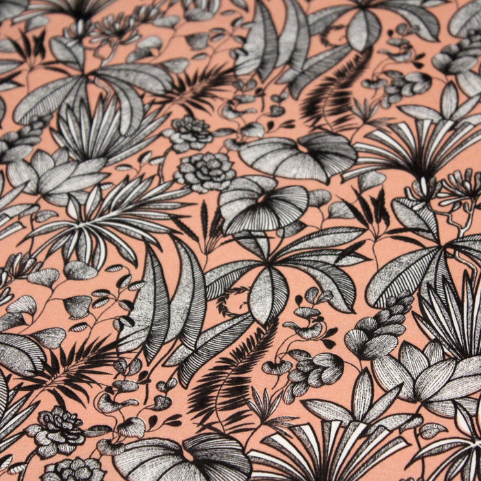 Tissu de coton JAVA aux fleurs & feuilles noires et blanches, fond corail - Oeko-Tex