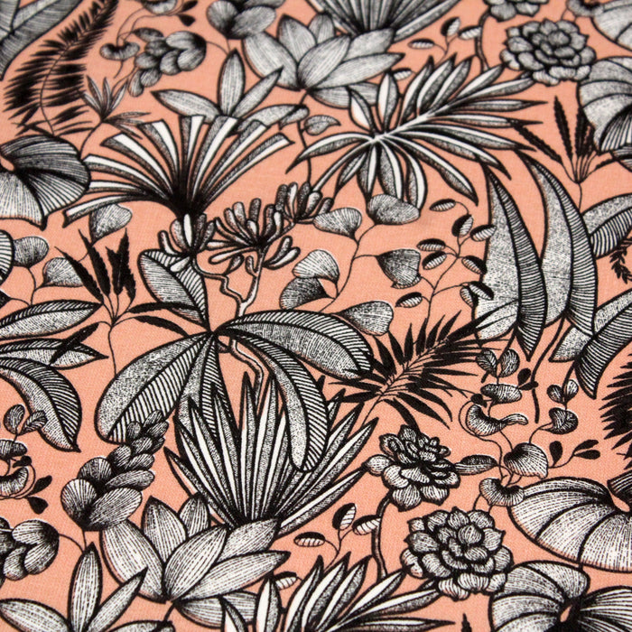 Tissu de coton JAVA aux fleurs & feuilles noires et blanches, fond corail - Oeko-Tex