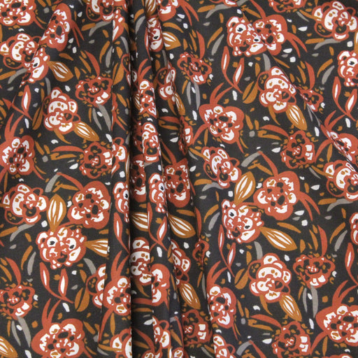 Tissu de coton tropical aux fleurs orange rouille, fond noir - Oeko-Tex - tissuspapi