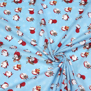 Tissu popeline de coton de Noël - Le père Noël, fond bleu ciel - TissusPapi.com