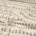 Tissu de coton de Noël scandinave aux bonshommes de neige, rennes, pingouins, sapins de Noël gris, fond écru - tissuspapi
