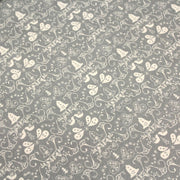 Tissu de coton de Noël scandinave aux cloches & arabesques écrues, fond gris - TissusPapi.com