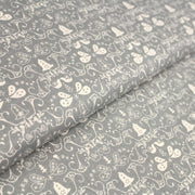 Tissu de coton de Noël scandinave aux cloches & arabesques écrues, fond gris - TissusPapi.com