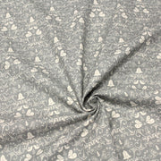 Tissu de coton de Noël scandinave aux cloches & arabesques écrues, fond gris - TissusPapi.com
