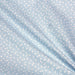 Tissu de coton aux petits triangles blancs, fond bleu ciel - OEKO-TEX® - tissuspapi