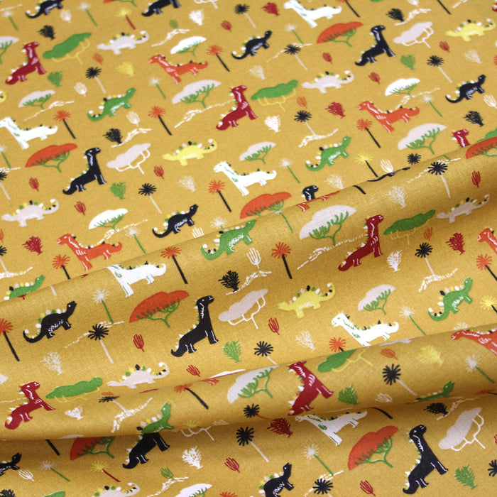 Tissu de coton les dinosaures & les arbres, fond jaune moutarde - Oeko-Tex - tissuspapi