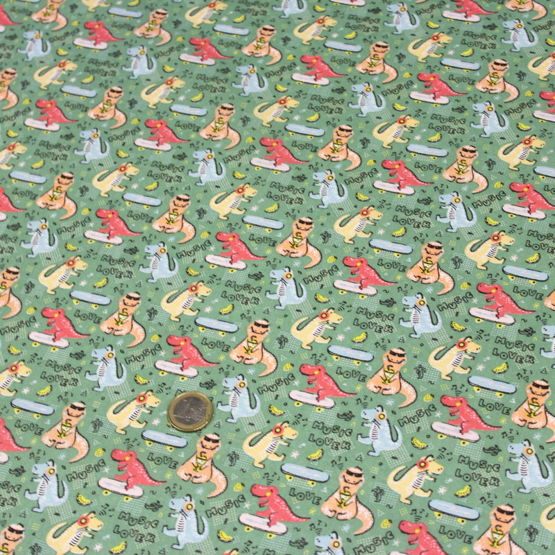Tissu de coton Dinosaure music lover, fond vert sauge - Oeko - Tex - TissusPapi.com