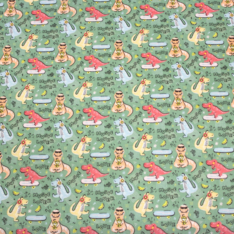 Tissu de coton Dinosaure music lover, fond vert sauge - Oeko - Tex - TissusPapi.com