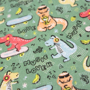 Tissu de coton Dinosaure music lover, fond vert sauge - Oeko - Tex - TissusPapi.com