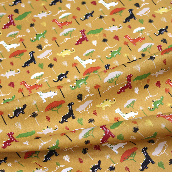 Tissu de coton les dinosaures & les arbres, fond jaune moutarde - Oeko-Tex - tissuspapi