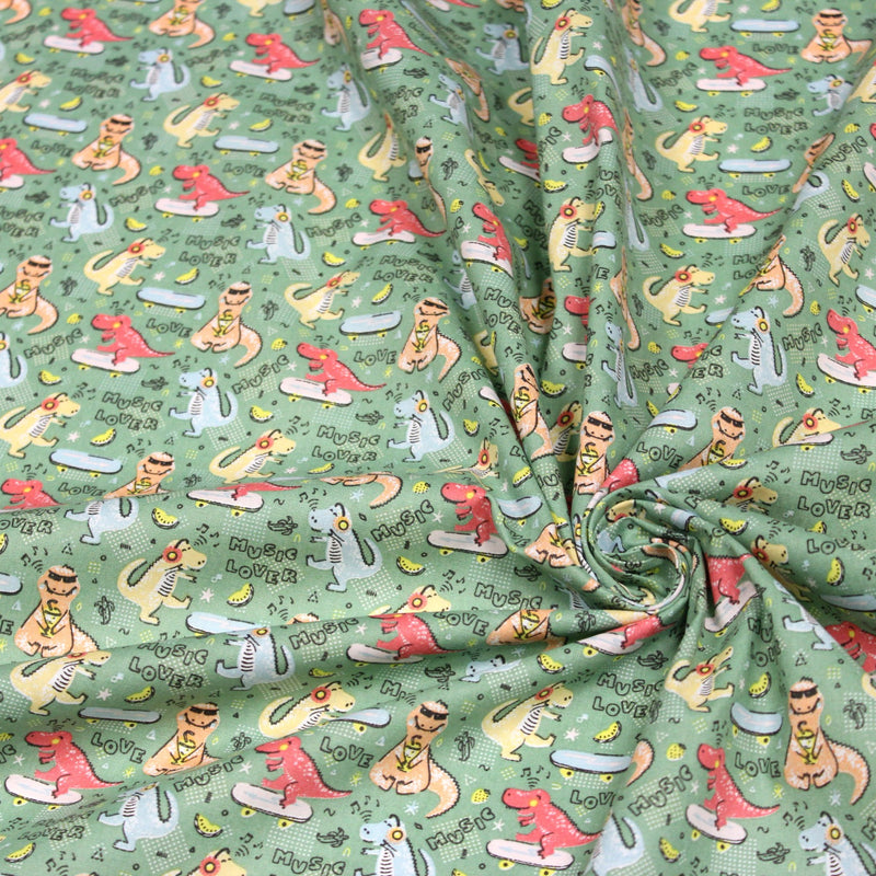 Tissu de coton Dinosaure music lover, fond vert sauge - Oeko - Tex - TissusPapi.com