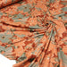 Tissu Jersey de viscose orange rouille aux fleurs vert amande & corail