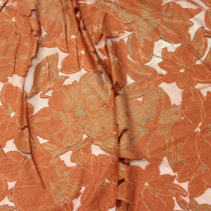 Tissu Jersey de viscose orange rouille aux fleurs vert amande & corail