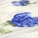 Tissu froissé polyester écru aux fleurs bleues