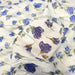 Tissu froissé polyester écru aux fleurs bleues - tissuspapi