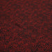 Tissu crêpe de polyester noir aux petits carrés rouges - tissuspapi