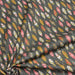 Tissu de coton aux plumes oranges, jaunes et écrus, fond vert kaki - OEKO-TEX® - tissuspapi