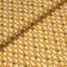 Tissu de coton aux plumes blanches et vertes, fond jaune moutarde - OEKO-TEX® - tissuspapi