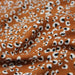 Tissu Microfibre de viscose caramel aux taches léopard noires et blanches - OEKO-TEX® - tissuspapi