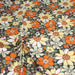 Tissu de coton fleuri seventies aux fleurs écrus & rouilles, fond vert kaki - COLLECTION SUNFLOWER - OEKO-TEX® - tissuspapi