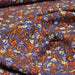 Tissu Microfibre de viscose violet, aux fleurs oranges, rouilles et écrues - OEKO-TEX® - tissuspapi